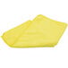 A yellow Unger SmartColor microfiber cloth folded on a white surface.