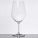 A clear Chef & Sommelier Bordeaux wine glass on a white surface.