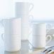A stack of Villeroy & Boch white bone porcelain coffee cups.