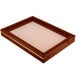 A wooden frame with a cherry finish and a white surface.