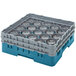 A blue and grey plastic Cambro glass rack with extenders holding clear glass cups.