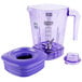 A purple Waring blender jar with a handle and lid.