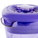 A purple plastic Waring blender jar with a lid.