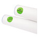 A roll of white paper with green round Avery labels.