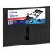 An Avery® black Slide and View 5-pocket file folder on a counter.