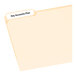 A file folder with a white Avery EcoFriendly label on the top tab.
