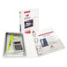 A white Avery mini binder with office supplies including a calculator and pen inside.
