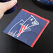 A Creative Converting New England Patriots beverage napkin with the team logo on it.
