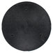 A black circular object with holes.