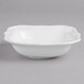 A Villeroy & Boch white porcelain bowl with a scalloped edge.