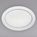 A white Villeroy & Boch porcelain oval plate with a round edge.