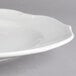 A close-up of a Villeroy & Boch white porcelain flat plate with a small rim.