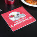 A close up of a Creative Converting Arizona Cardinals 2-ply luncheon napkin with the Arizona Cardinals logo.