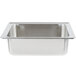 A stainless steel Vollrath water pan in a white sink.