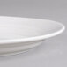 A close up of a white Villeroy & Boch porcelain small oval pickle dish.