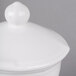 A white ceramic Villeroy & Boch covered sugar bowl on a white surface.