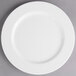 A white Villeroy & Boch porcelain plate with a white rim on a gray surface.