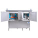 A large stainless steel Jackson RackStar conveyor dishwasher with open blue doors.