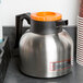 Choice 64 oz. 7" x 6 3/8" Insulated Thermal Coffee Carafe / Server Orange Brew Thru Lid Main Thumbnail 7