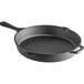 A black round cast iron skillet with a helper handle.