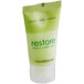 A green and white plastic container of Dial Restore Conditioner.