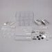 A white rectangular plastic assembly kit with clear plastic containers inside.