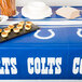 A table with an Indianapolis Colts plastic table cover on it.