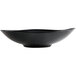 A black Reserve by Libbey Pebblebrook bowl with a curved edge.