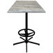 A Holland Bar Stool square outdoor bar height table with a greystone top and black base.