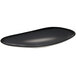A black oval porcelain tray with an organic shape and a white border.