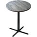 A round Holland Bar Stool outdoor bar height table with a metal base and a grey surface.