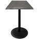 A Holland Bar Stool charcoal table with black round base.
