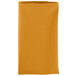 A folded orange Intedge polycotton cloth napkin.