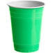 A green plastic Choice cup on a white background.