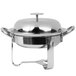A Libbey stainless steel chafing dish with a lid on a stand.