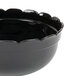 A black Cal-Mil fluted bowl with scalloped edges.