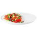 A Rosseto white melamine tray with vegetables and salad on it.