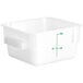 A white translucent square Choice food storage container with green writing.