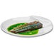 A white Rosseto melamine cocktail plate with a fish and green sauce.