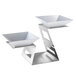 A Rosseto stainless steel riser with two square white porcelain bowls.
