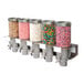 A row of Rosseto candy dispensers filled with different types of candy.