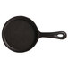 A black Libbey mini round cast iron skillet with a handle.