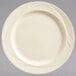 A Libbey cream white china plate with a swirl design on the rim.