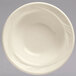 A Libbey cream white china grapefruit bowl with a wavy design on the edge.