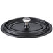 The black metal lid with a metal knob on a black Libbey mini cast iron dutch oven.