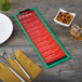 A customizable wood menu clip board on a table with a menu, fork, and knife.