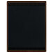 A black rectangular board with a walnut wood frame and top and bottom brown wood strips.