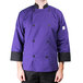 A person wearing a Mercer Culinary purple chef coat.