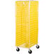 A yellow Curtron breathable mesh bun pan rack cover.