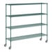 A green metal wire shelving unit with casters.
